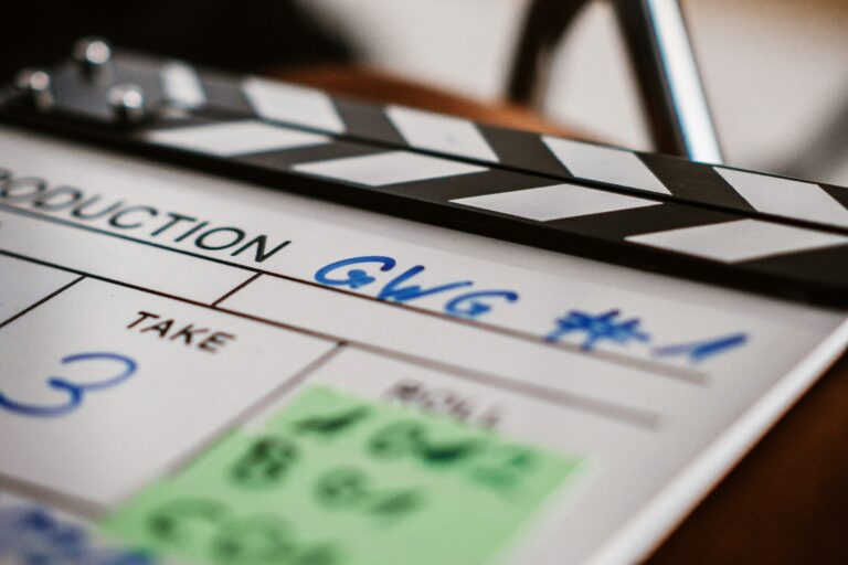 Clapperboard representing film and TV content investments.