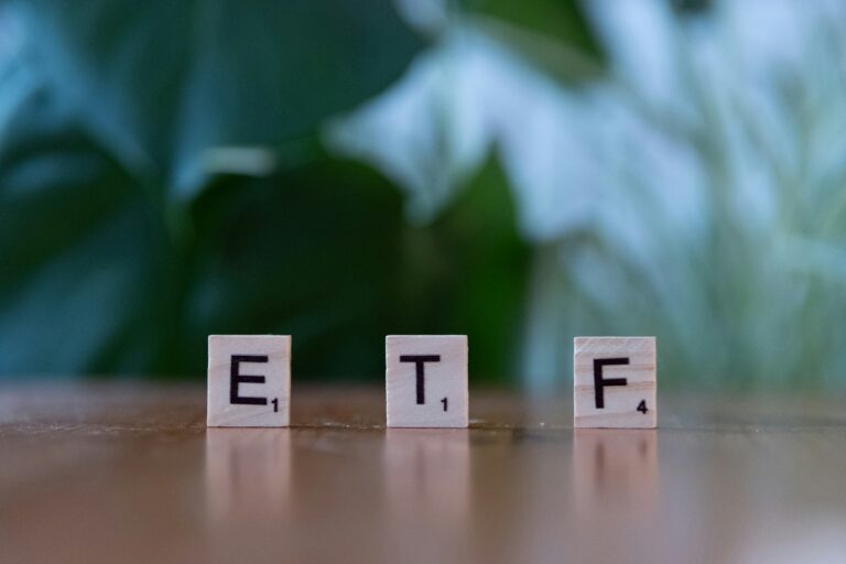 Wooden blocks spelling ETF representing exchange-traded funds and modern investment solutions.