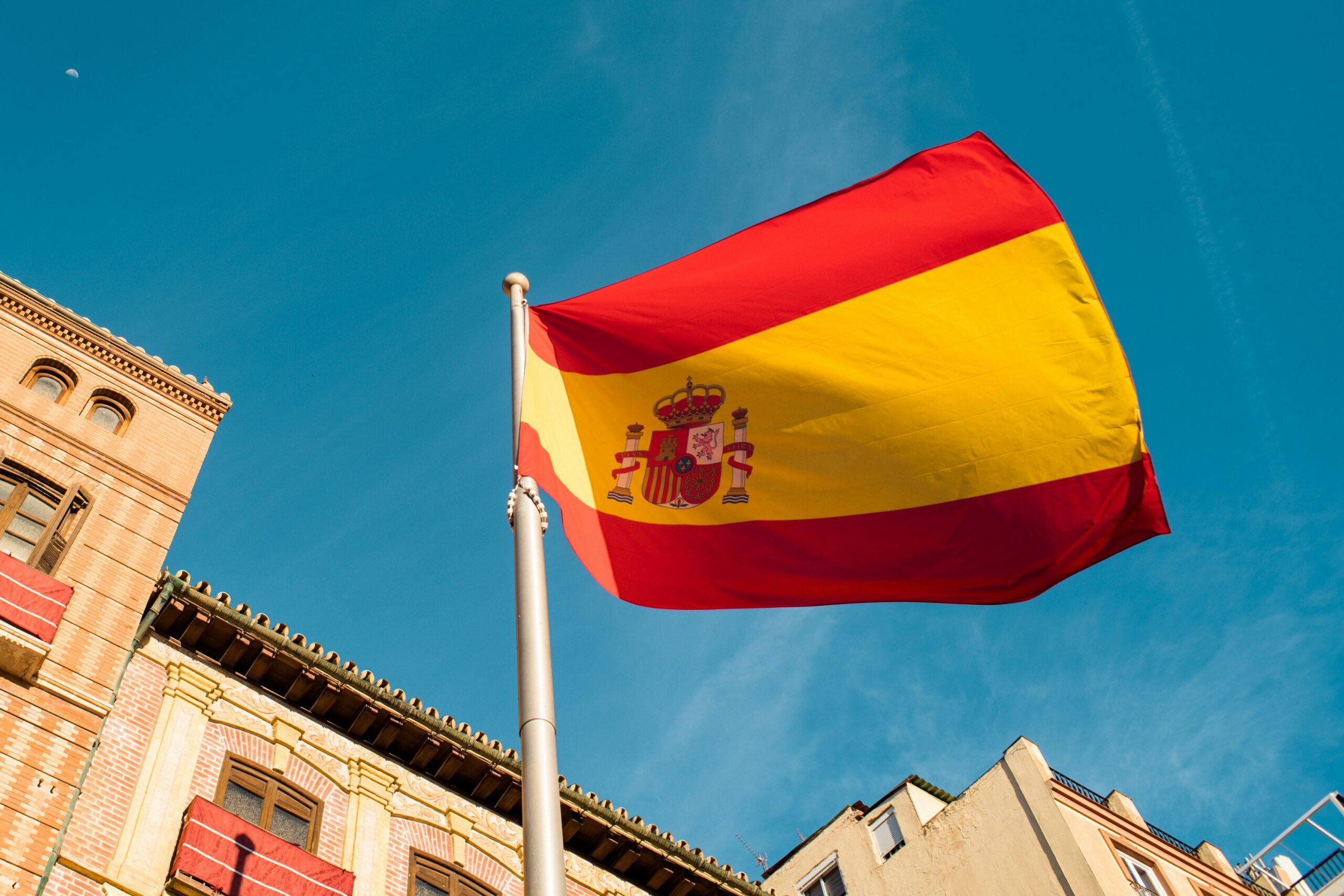 Spanish flag representing Spain's growing role in tokenised fund distribution